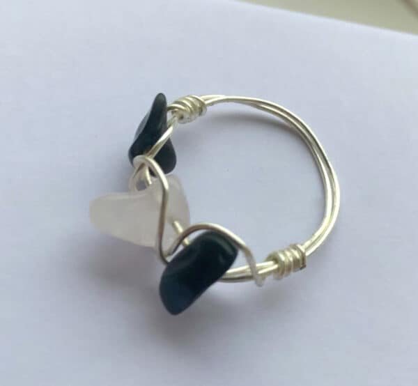 silver ring with black and white stones