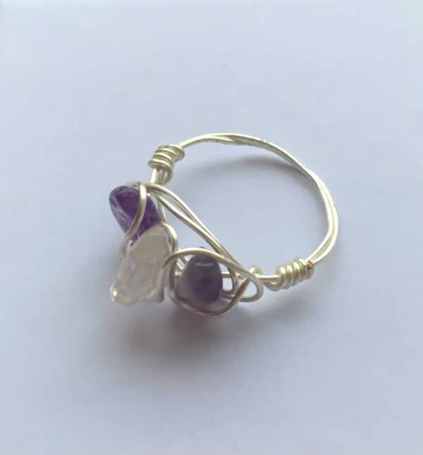 silver ring with three purple stones